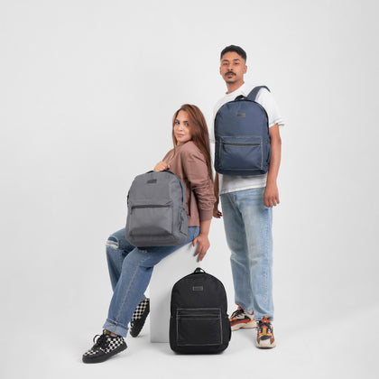 man and woman with three backpacks
