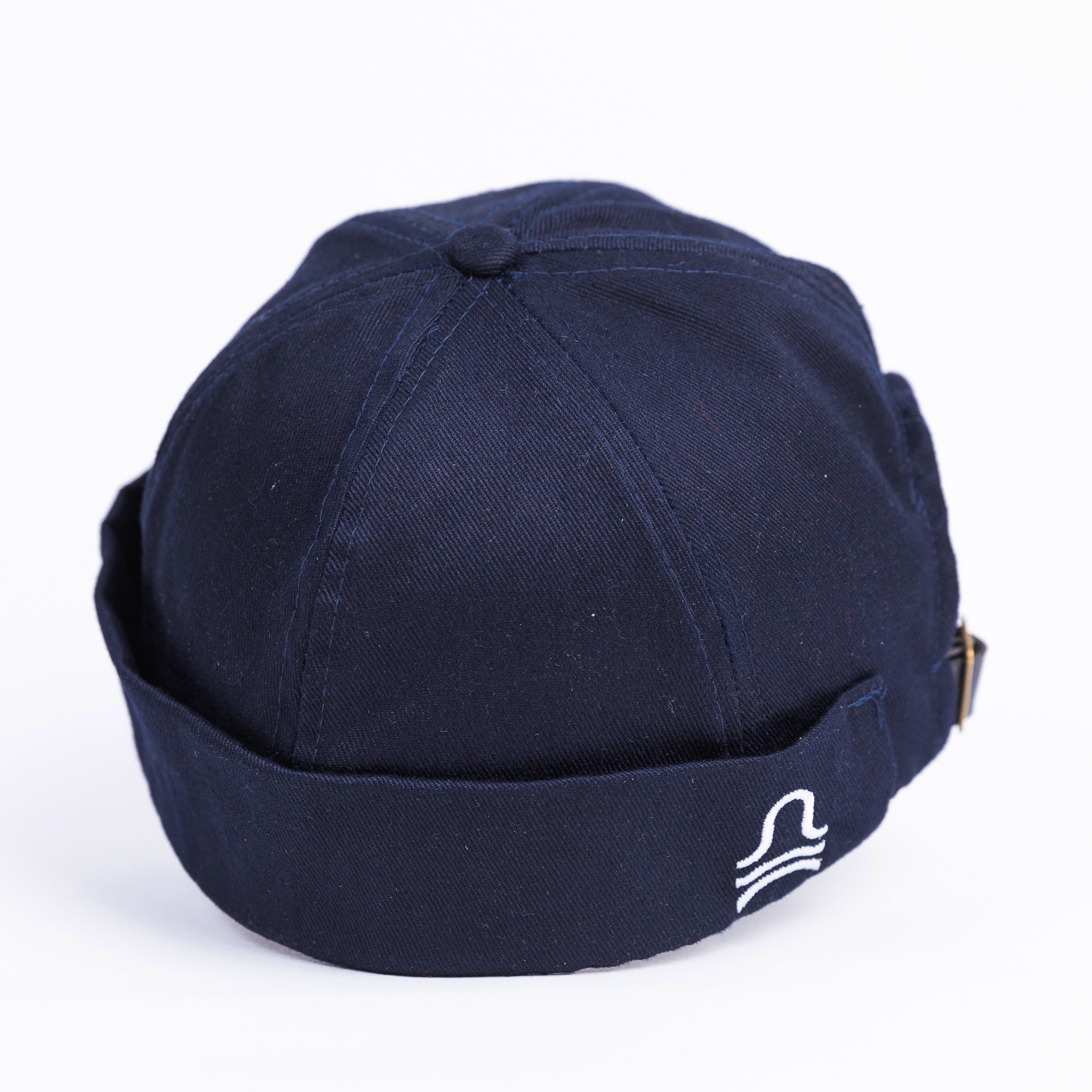 Navy blue cap with a logo on a white background