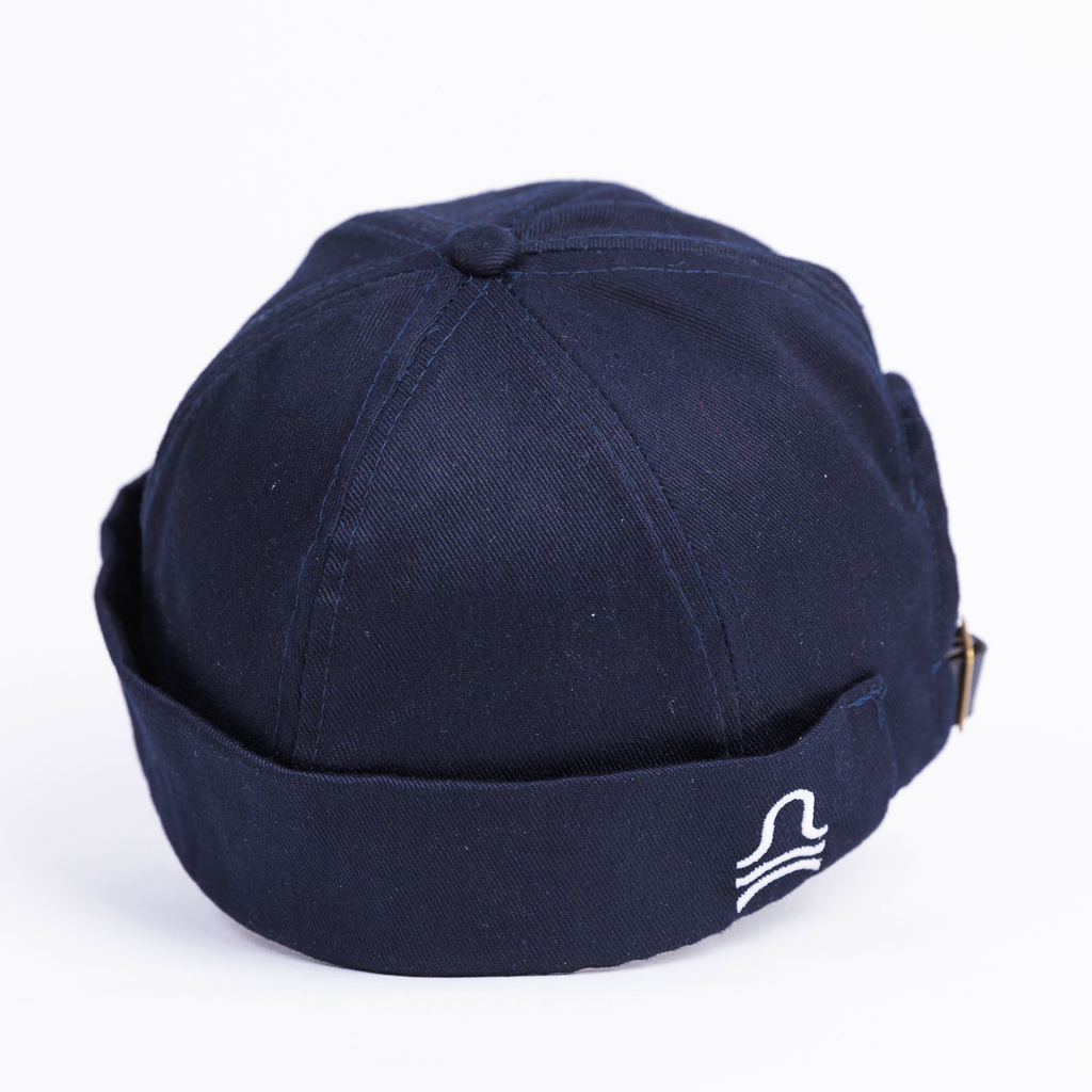 Navy blue cap with a logo on a white background