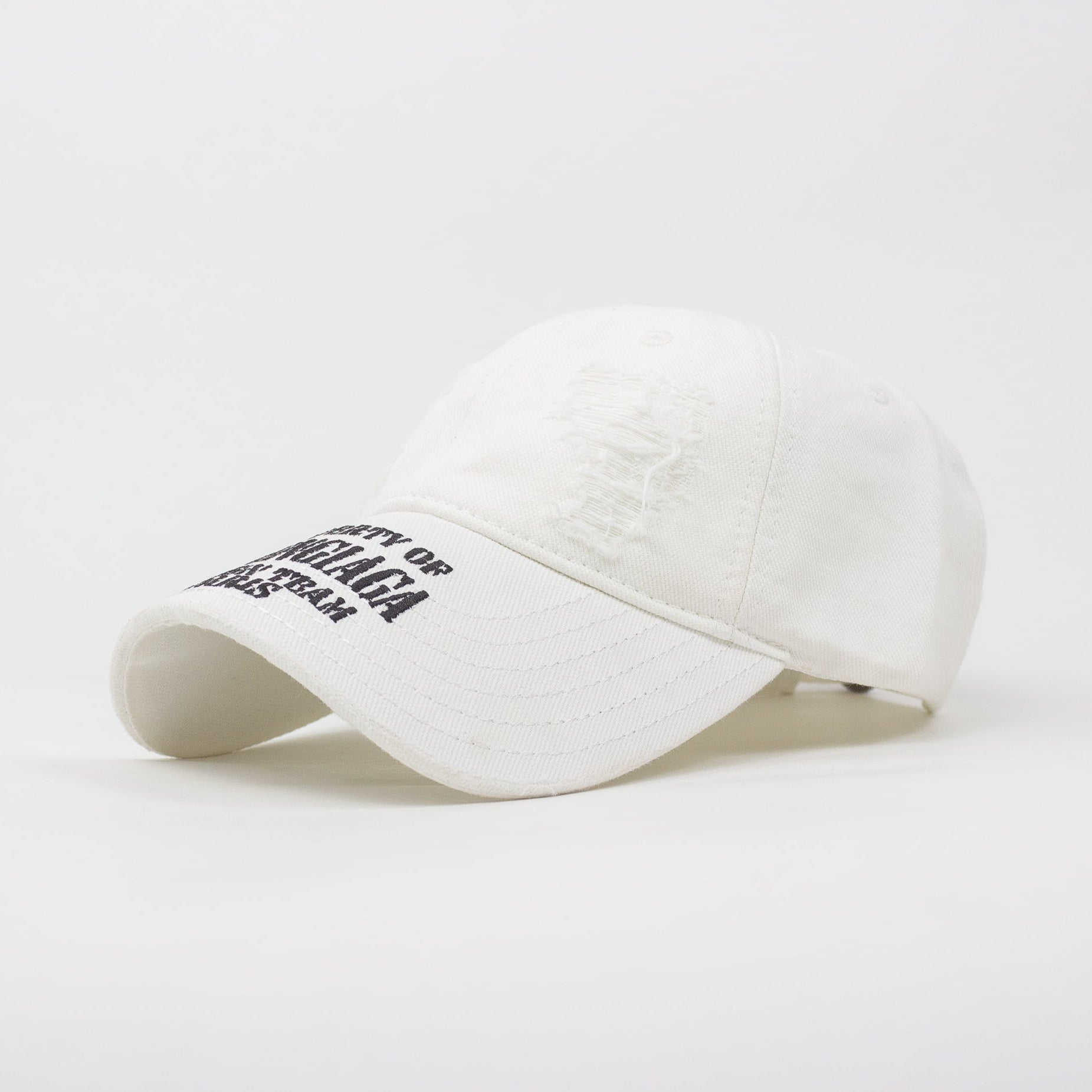 White cap with black text on a white background