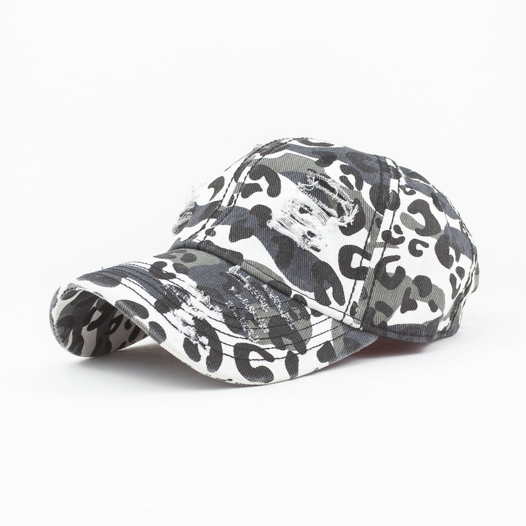 Camouflage-patterned cap on a white background