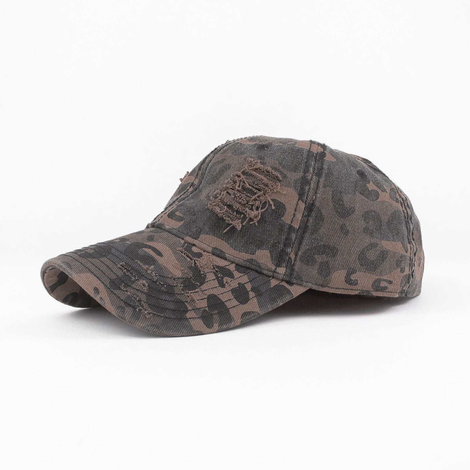 Camouflage-patterned baseball cap on a white background