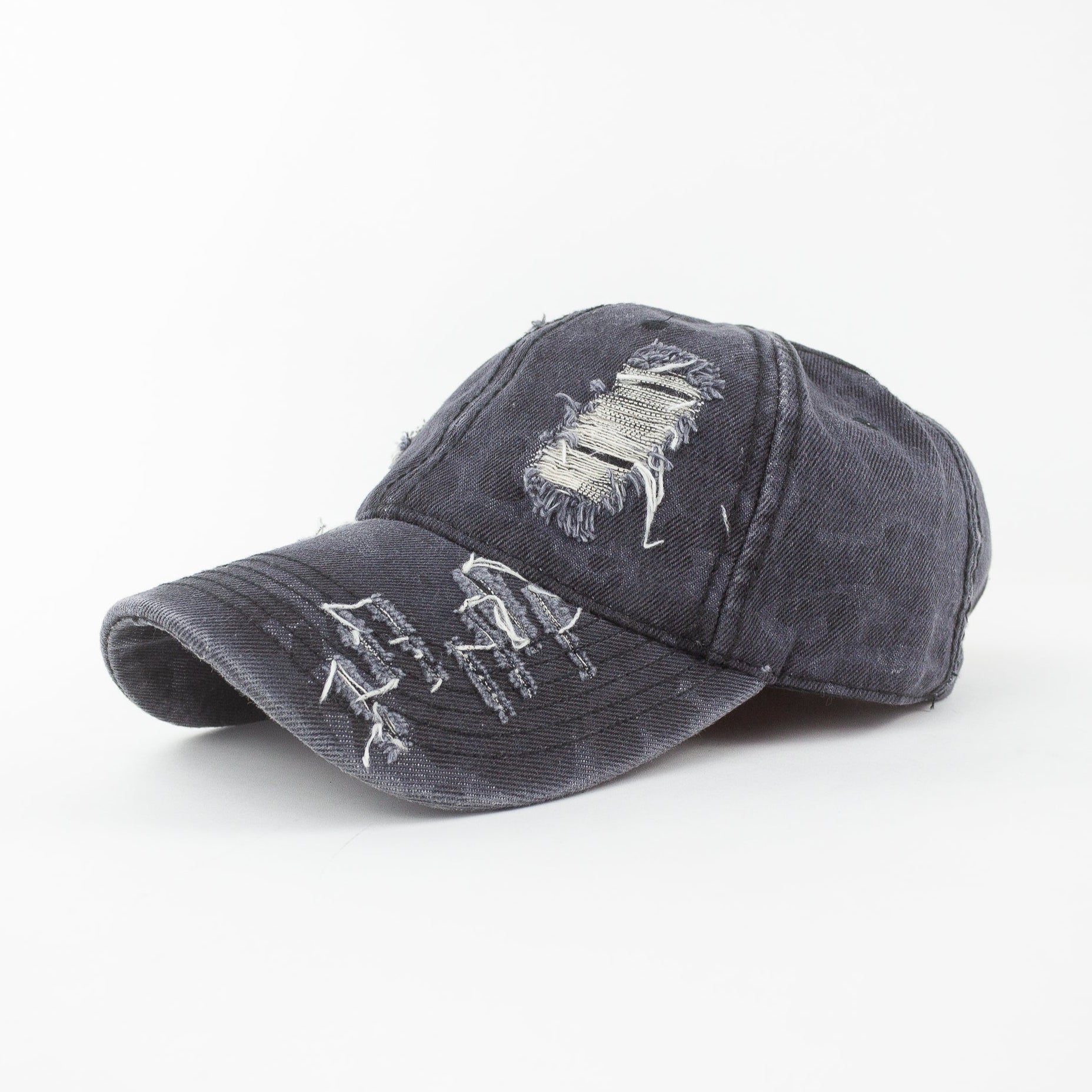 Gray distressed baseball cap with embroidered designs on a white background