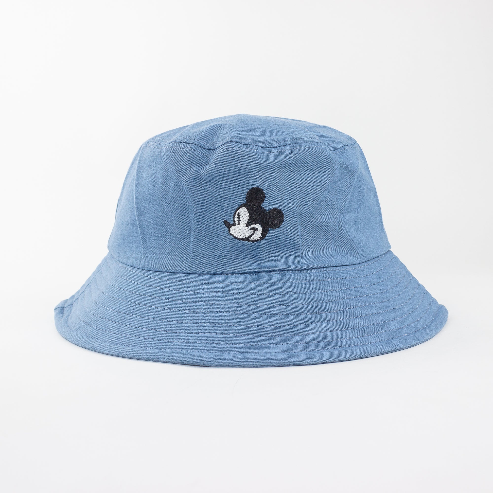Blue bucket hat with a cartoon character on a light gray background