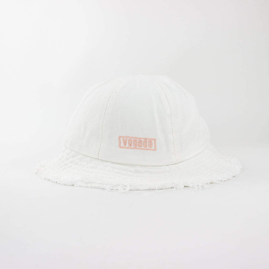 White cap with a pink logo on a white background