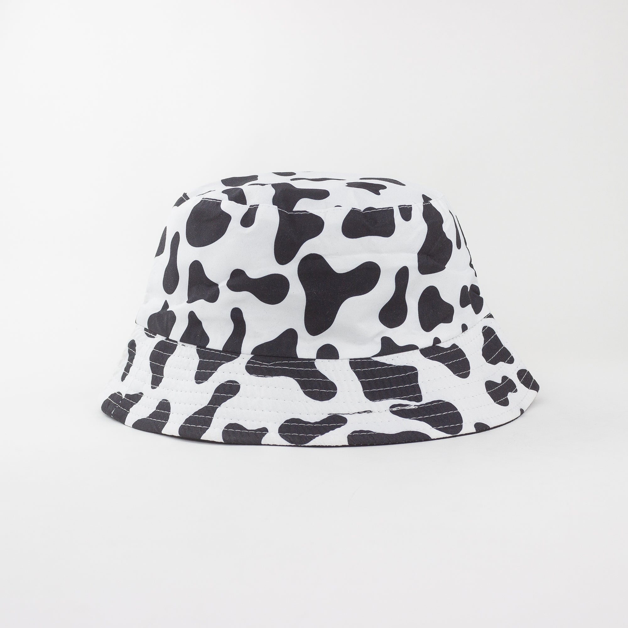 Bucket hat with black and white abstract pattern on a light gray background