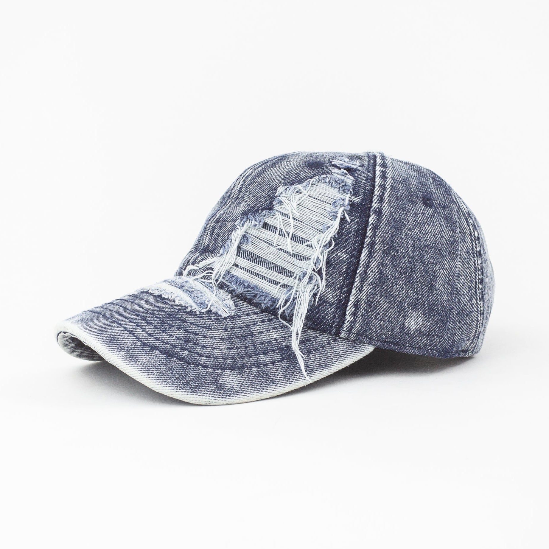 Blue denim cap with distressed details on a white background