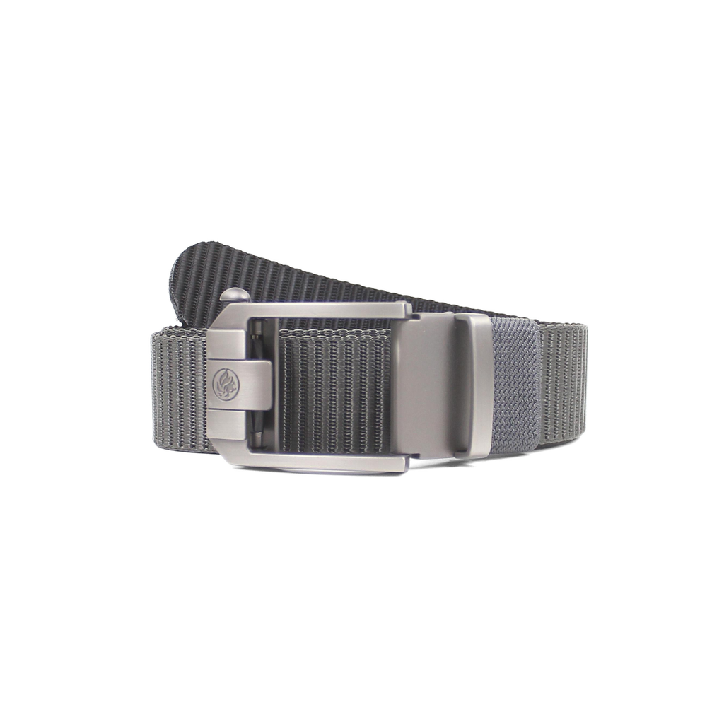 Coiled dark grey nylon tactical belt with a distinct textured grey reverse side and a gunmetal ratchet buckle, isolated on white background.
