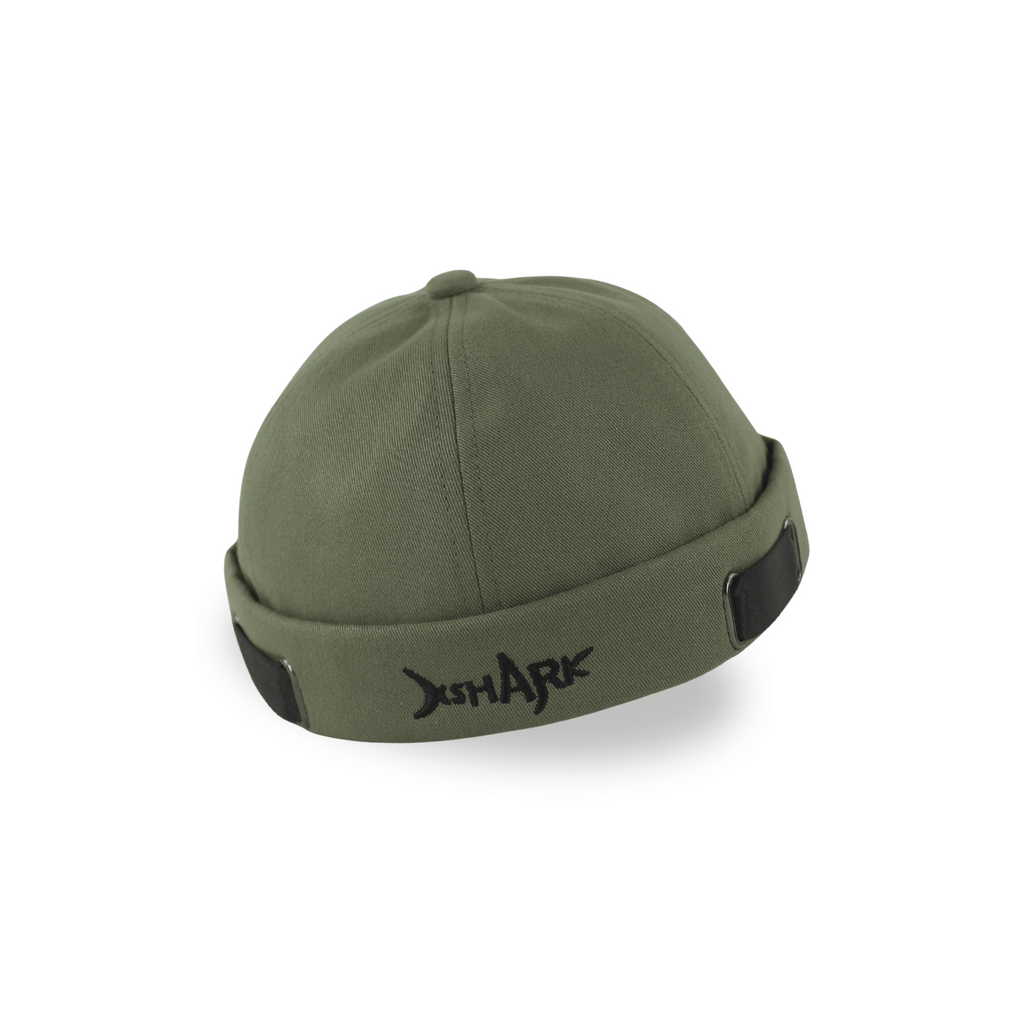 Profile view of a premium olive green brimless docker hat for men with black embroidery and adjustable side straps.